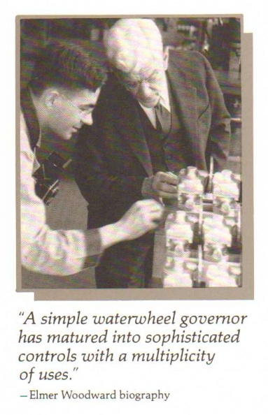 Elmer Woodward showing his propeller governors to a co-worker